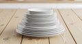 Stack of White Plates on Wood Table. Kitchenware Concept. Royalty Free Stock Photo