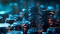 A close-up of a stack of coins under a blue light, with a shallow depth of field, highlighting the stacks of coins in the Royalty Free Stock Photo
