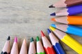 Close up stack color pencils on wooden background Royalty Free Stock Photo