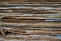 stack of containerboard sheets or old brown box paper recycle in warehouse facility Royalty Free Stock Photo