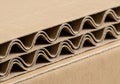 Close-up of a stack of corrugated cardboard, showcasing its distinctive wave-like structure. The Royalty Free Stock Photo