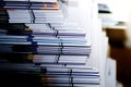 Close-up of stack of documents on office desk in library Selective focus