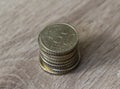 Stack of fifty euro cent coins on wooden background Royalty Free Stock Photo