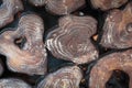 close up of a stack of firewood with many tree rings