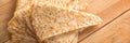 Close up on a stack of folded crepes french pancakes on wood panoramic background