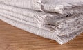 Close-up of a stack of gray linen kitchen napkins for household and dining use