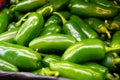 close up on a stack of green bell peppers on a market stall Royalty Free Stock Photo