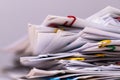 Close-up of Stack of Group report papers Document clipped in color clips.