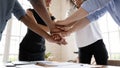 Close up stack hands of diverse international company workers.