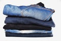 Close up stack of man jeans denim on white background Royalty Free Stock Photo