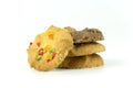 Close up stack of many variety homemade cookies isolated on white background.