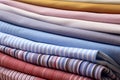 Close up of stack of neatly folded colorful clothes or fabric