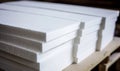 Close up stack of new white tiles in construction site, stock photo