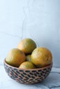 Close up of stack of orange in a bowl