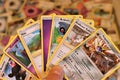 Close up of a stack of Pokemon cards.