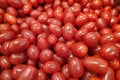 Stack of red plum tomatoes a market stall Royalty Free Stock Photo