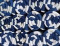 Close up stack of rolled blue and white towels