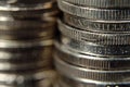 Close up of stack of silver coins showing increasing value Royalty Free Stock Photo