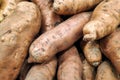 Stack of Sweet Potatoes on a market stall Royalty Free Stock Photo