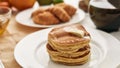 Close up of stack of sweet tasty pancakes on a plate, Breakfast served on the table