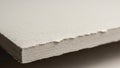 Close-up of a stack of textured paper showing a slightly uneven edge Royalty Free Stock Photo