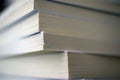 Close-up of a stack of various books.