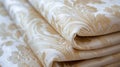 A close up of a stack of white and gold fabric, AI