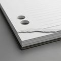 Close-up of a stack of white lined notebook paper with two punched holes. The sheet Royalty Free Stock Photo
