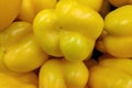 Stack of yellow bell peppers on a market stall Royalty Free Stock Photo