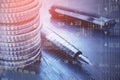 Close up of stacked coins, pen and forex chart on blurry desktop background. Financial management, money and currency concept. Royalty Free Stock Photo