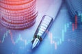 Close up of stacked coins, pen and forex chart on blurry desktop background. Financial management, money and trade concept. Double Royalty Free Stock Photo