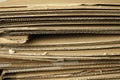 Close-up of stacked corrugated cardboard on white background Royalty Free Stock Photo