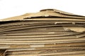 Close-up of stacked corrugated cardboard on white background Royalty Free Stock Photo