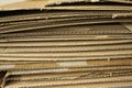 Close-up of stacked corrugated cardboard on white background Royalty Free Stock Photo