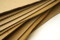 Close-up of stacked corrugated cardboard on white background Royalty Free Stock Photo