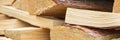 Close-up of stacked firewood with rough cut edges and natural bark texture Royalty Free Stock Photo