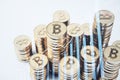 Close up of stacked golded bitcoins and growing business chart grid on blurry backdrop. Corporate growth plan, cryptocurrency and