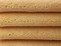 close up of stacked italian savoiardi cookie, biscuit background, texture of biscuits Royalty Free Stock Photo