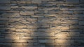 Stacked rough grey stone wall with illuminated textured surfaces and deep shadows creating a solid background Royalty Free Stock Photo