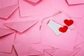 close up Stacking of pink envelopes and a mail letter paper and