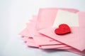 close up Stacking of pink envelopes and a mail letter paper and