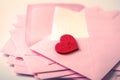 close up Stacking of pink envelopes and mail letter paper and th