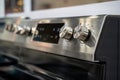 Close up of stainless steel stove control knobs and panel Royalty Free Stock Photo