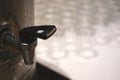 Close up of stainless water dispensers cooler with glass . Royalty Free Stock Photo