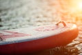Close up of a stand up paddle board SUP and paddle on a dock Royalty Free Stock Photo