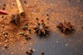 Close-up of star anise and cinnamon and ground pepper lie on the table. Spicy food concept and oriental cuisine Royalty Free Stock Photo