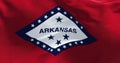 Close up of the state flag of Arkansas waving in the wind on a clear day