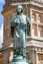 Close up of statue of Bishop Roger on the Digby Memorial Cross in front of Sherborne Abbey in Sherborne, Dorset, UK