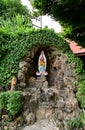 Statue of Our lady of grace virgin Mary view with natural background in the rock cave at Thailand. selective focus. Royalty Free Stock Photo