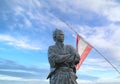 Close-up on the statue of the samurai Sakamoto with his Kaientai flag at Kazagashira park observatory.